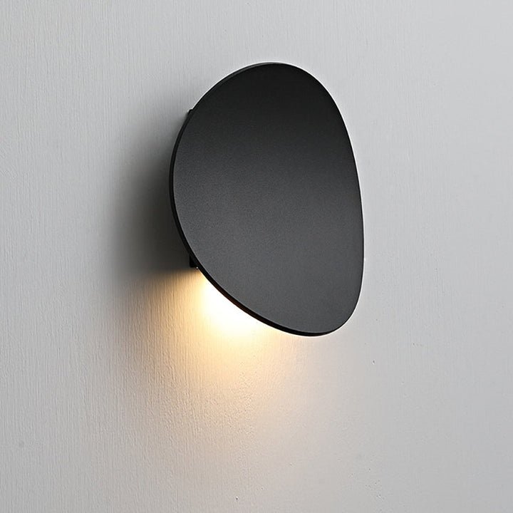 Aluminum minimalist wall sconce by Serevex, an energy-efficient LED fixture providing soft modern indoor lighting.