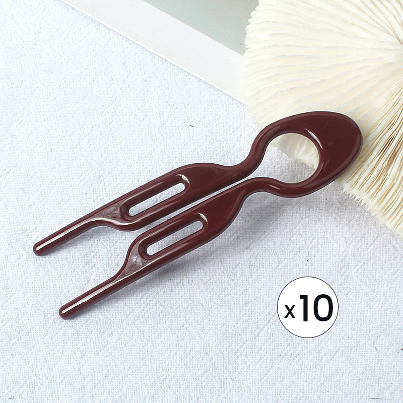 Hair pin set displayed with other hair accessories, highlighting its versatility for updos.