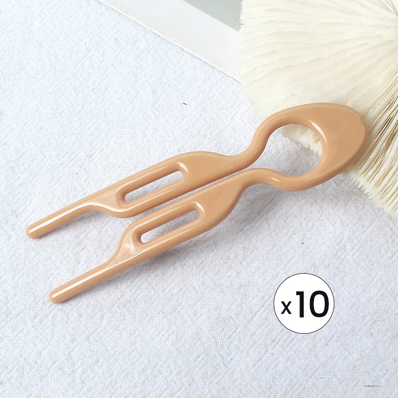 Elegant evening updo, masterfully crafted with the discreet yet strong hair pins.