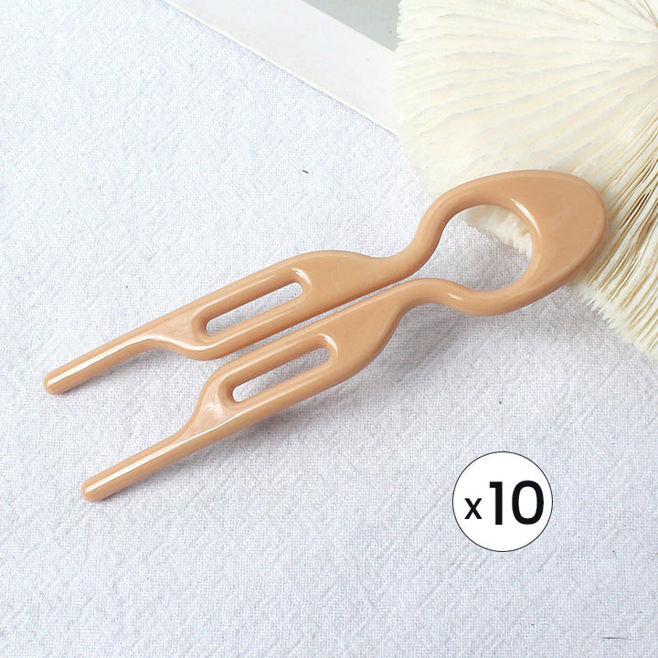 Elegant evening updo, masterfully crafted with the discreet yet strong hair pins.