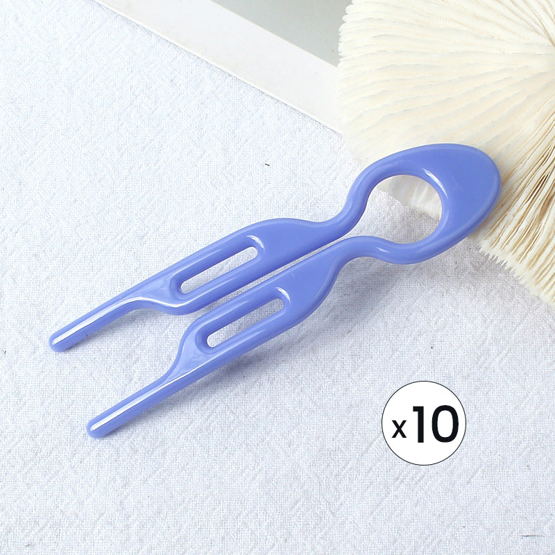 Hair pin set on a vanity table, suggesting daily use for women's hair styling.