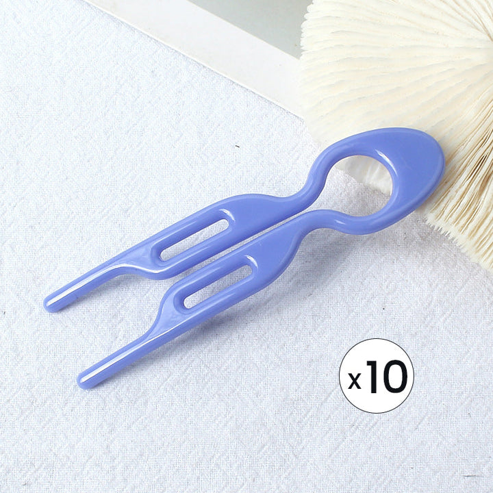 Hair pin set on a vanity table, suggesting daily use for women's hair styling.