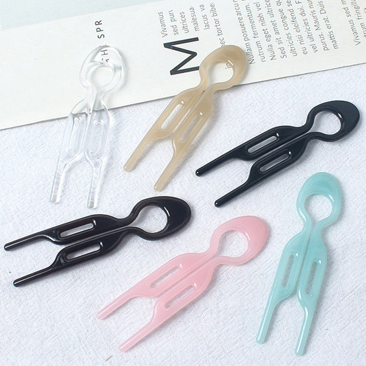 Detail shot of the hair pin's end, showing its structure for secure hold in women's updo hair.