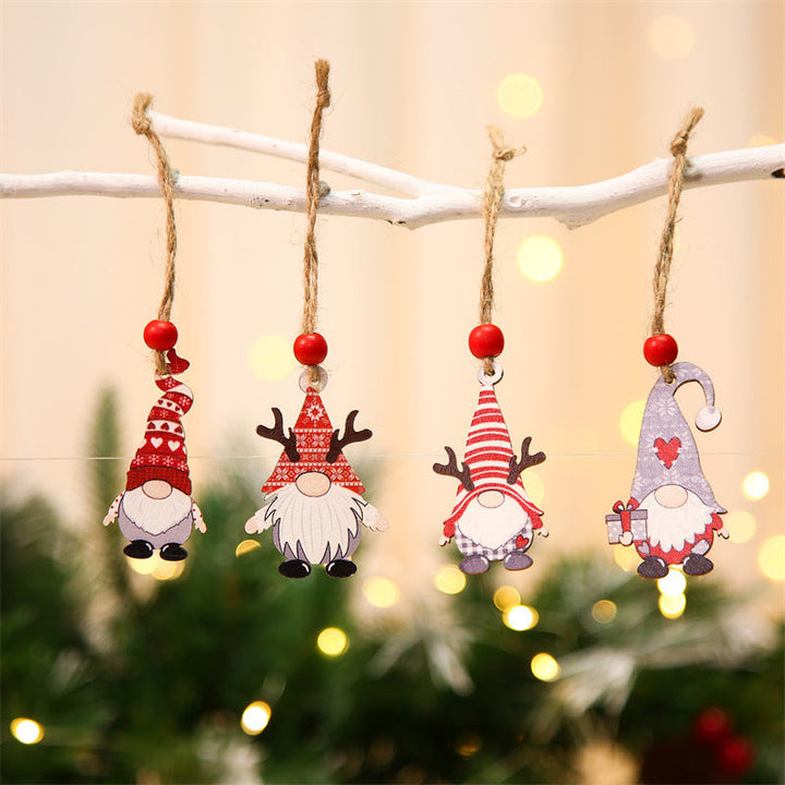 Wooden gnome ornaments styled on a Christmas tree branch, showcasing holiday cheer & homedecor