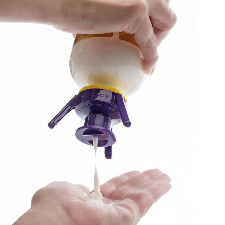 Bottle emptying kit in use, inverted on a counter, getting every last drop of product