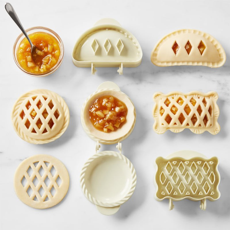 Open mini hand pie mold showing crimping edges, ready for making small, sealed turnovers or empanadas