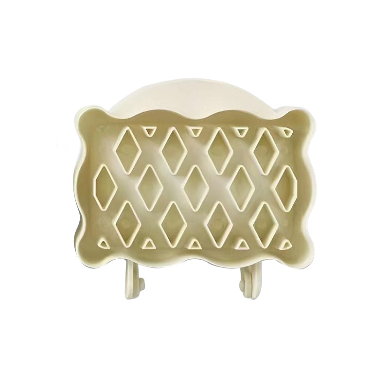 Ergonomic mini hand pie molds in red, blue, and yellow, designed for easy and efficient pastry making