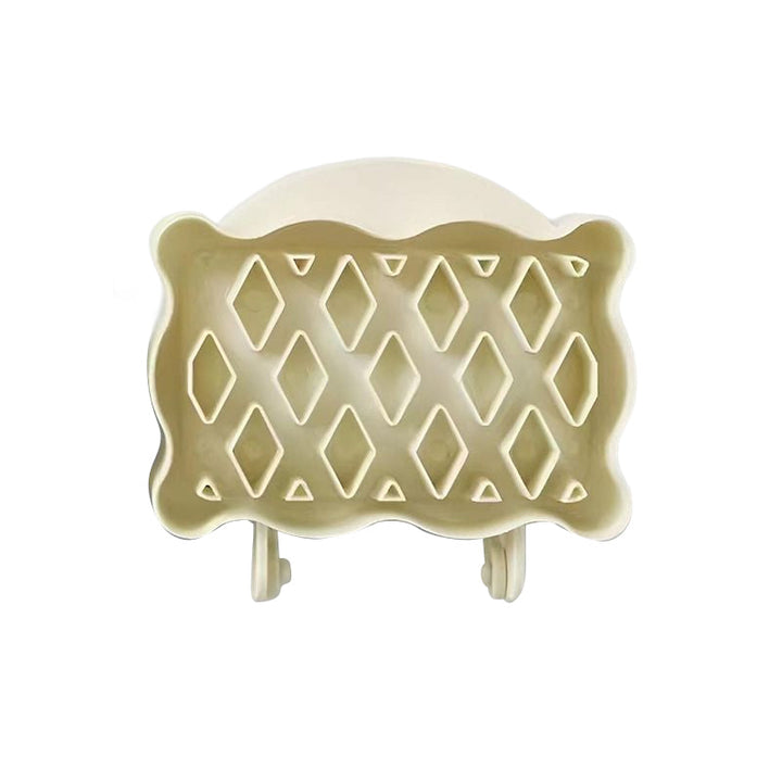 Ergonomic mini hand pie molds in red, blue, and yellow, designed for easy and efficient pastry making