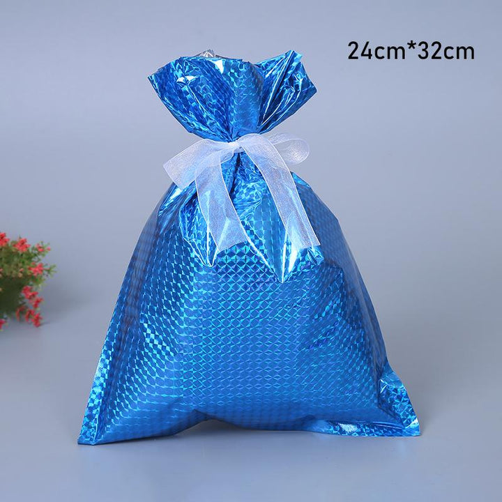Close-up of the smooth fabric and reliable drawstring closure on a reusable Christmas gift bag, high quality wrapping