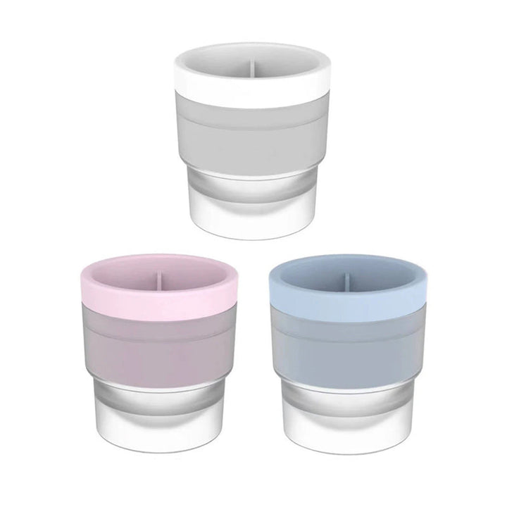 Assorted drinks with sphere ice balls made from the stackable molds, enhancing cocktail presentation.