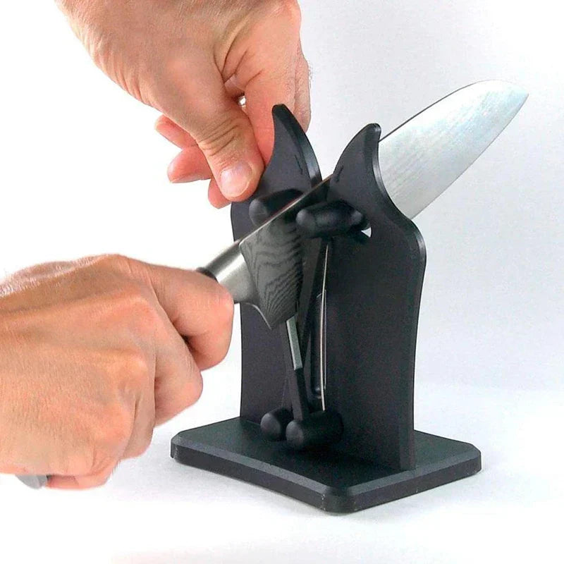 Compact SharpMaster Pro knife sharpener, black and silver, ensures sharp blades for kitchen tasks.