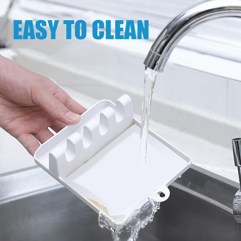 Multi-slot silicone utensil rest for kitchen organization, gray, keeps cooking tools elevated
