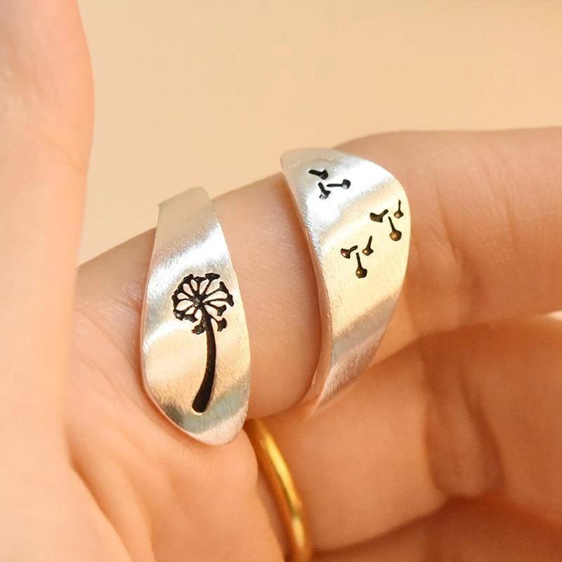 Elegant adjustable silver ring featuring a dandelion and mountain motif, fashion accessory