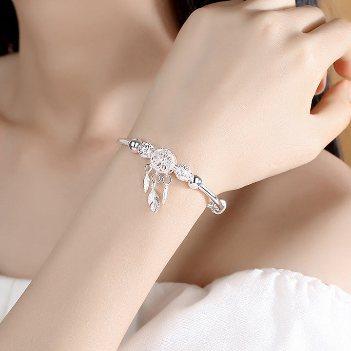 Womens silver dreamcatcher charm bracelet, detailed, adjustable fit, ideal gift accessory