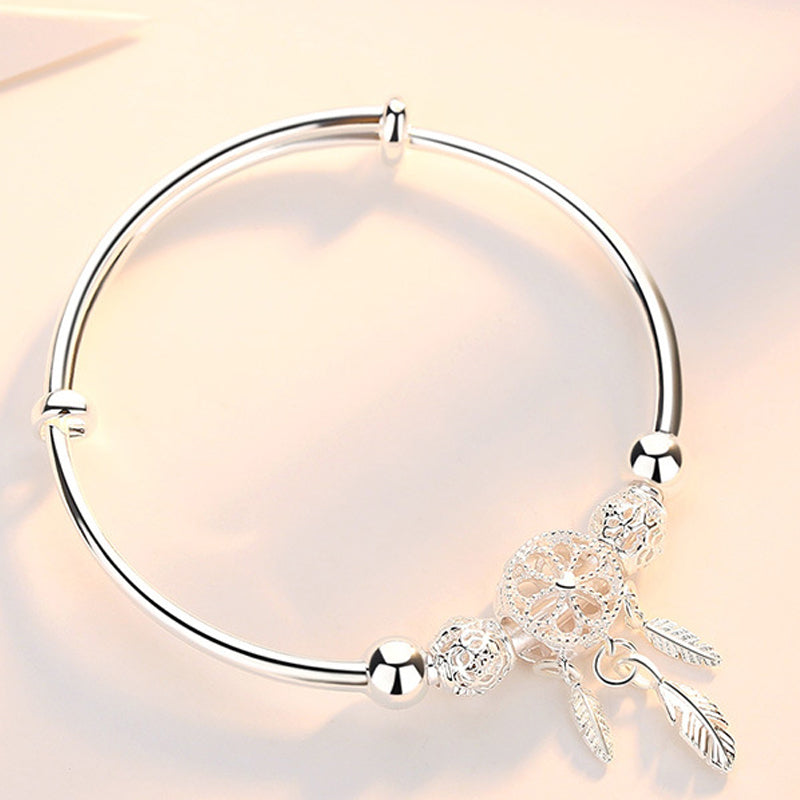 Elegant women's dreamcatcher accessory, silver charm bracelet, adjustable, ready for gifting