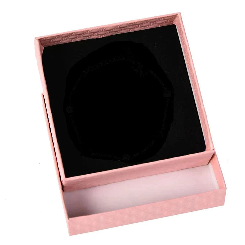 Detailed view of women's adjustable silver dreamcatcher bracelet and accompanying gift box