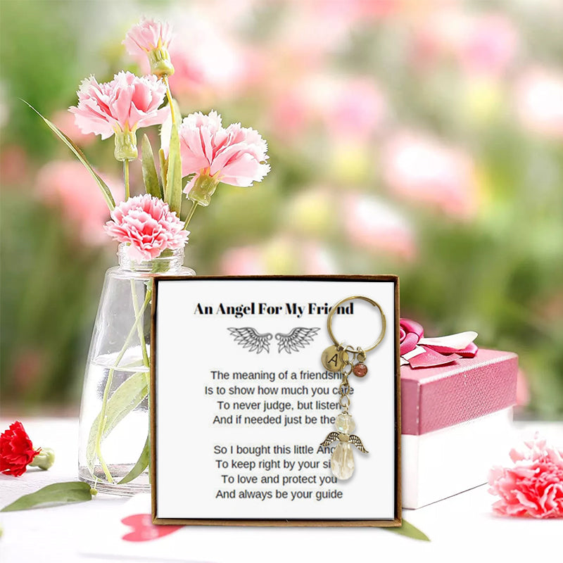 Angel wing keychain accessory for women & girls, symbolizing protection & friendship, a charming gift.