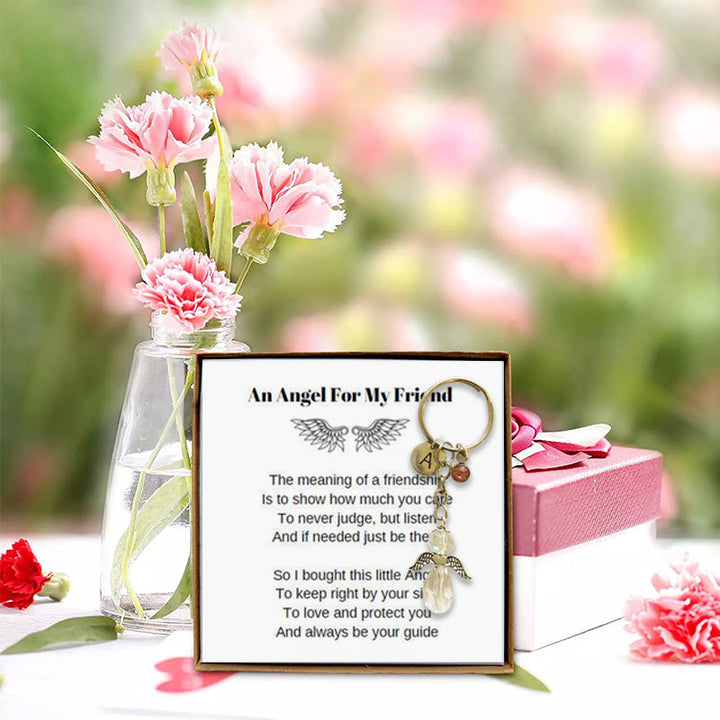 Angel wing keychain accessory for women & girls, symbolizing protection & friendship, a charming gift.