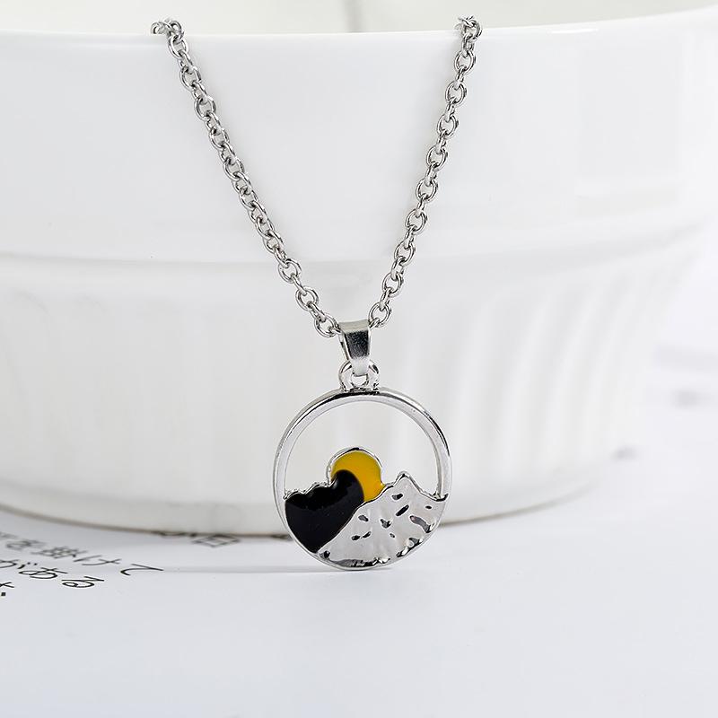 Unisex nature-inspired mountain jewelry, featuring a detailed landscape design in silver alloy.