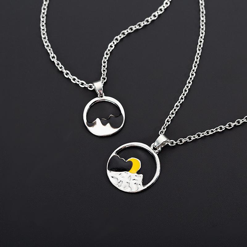 Two silver mountain outline necklaces, a perfect matching set for couples, nature-themed.