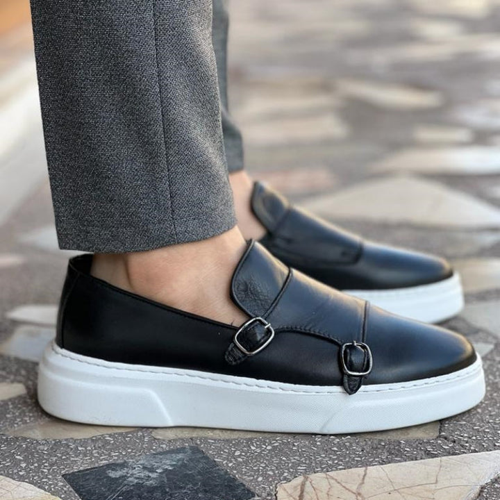 Stylish men's buckle sneakers worn, highlighting their versatile dress casual look and comfortable design.