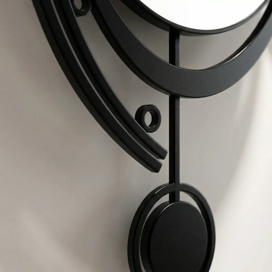 Retro-modern black & white silent pendulum wall clock, a stylish statement piece for living rooms.