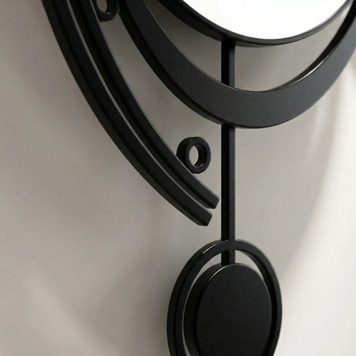 Retro-modern black & white silent pendulum wall clock, a stylish statement piece for living rooms.