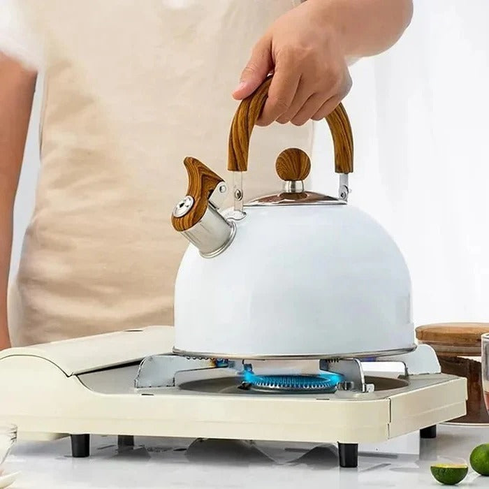 Sleek stainless steel whistling kettle with an insulated handle, ideal for tea, coffee & boiling water on any stovetop.