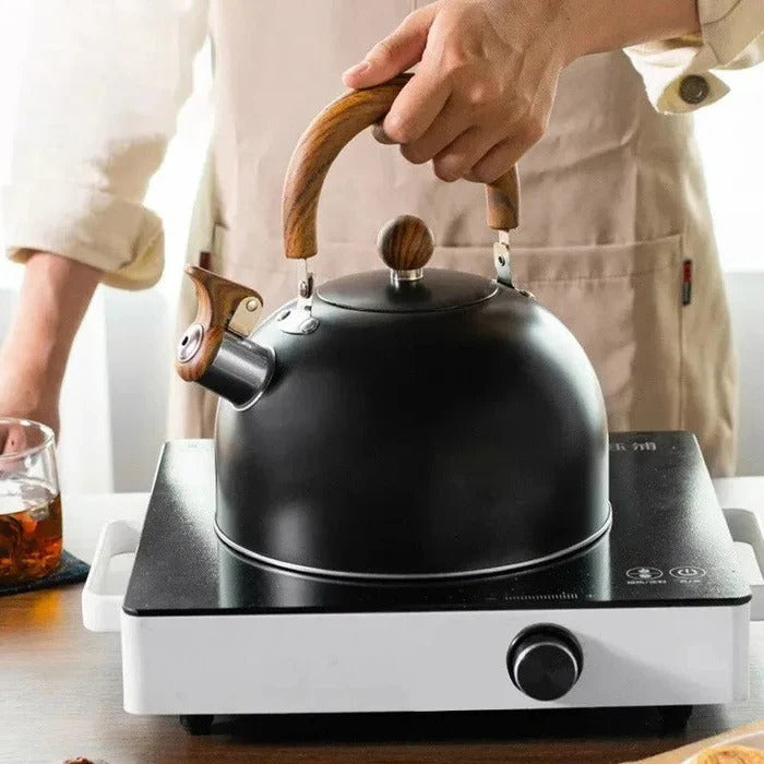 Durable stainless steel stovetop whistling kettle. Perfect for gas or induction, with a cool-touch handle for safe hot water.