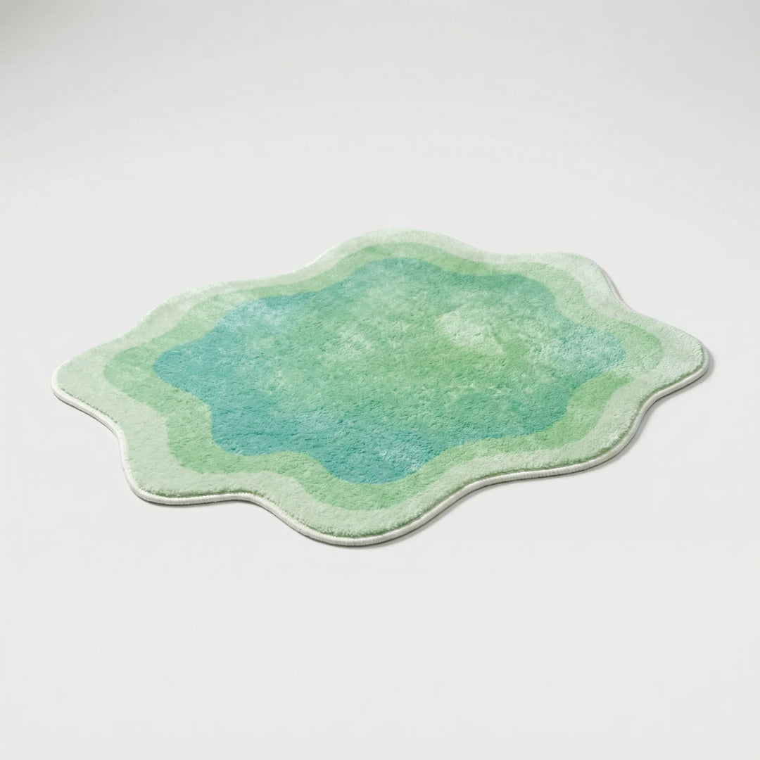 Plush gradient area rug with stylish wave pattern, a soft modern home decor accent for living room or bedroom.