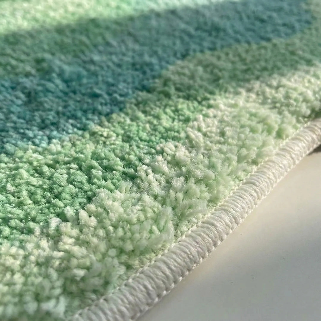 Modern Flowique gradient area rug with soft waves, colorful & non-slip, perfect for contemporary living rooms.