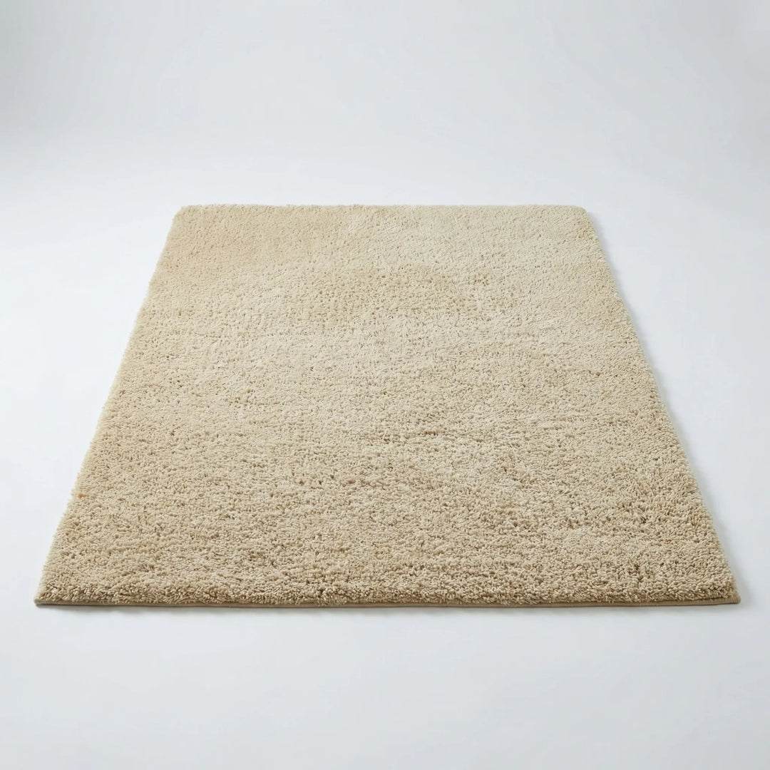 Plush modern low pile shag area rug with elegant wave pattern for bedroom or nursery.