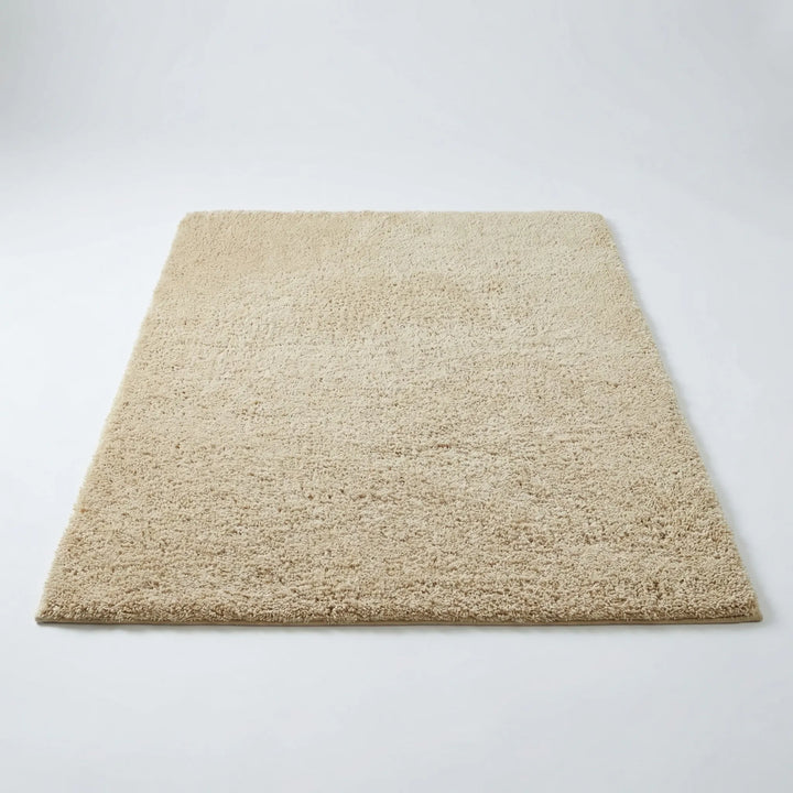 Plush modern low pile shag area rug with elegant wave pattern for bedroom or nursery.