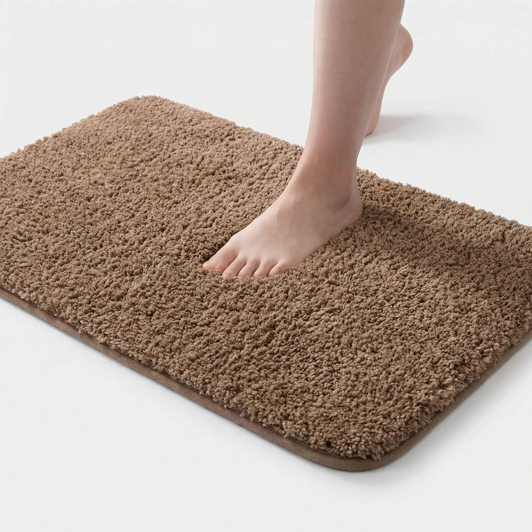 Flowique unisex rectangular plush bath mat; non-slip, absorbent, & machine washable. Perfect for bathroom comfort.