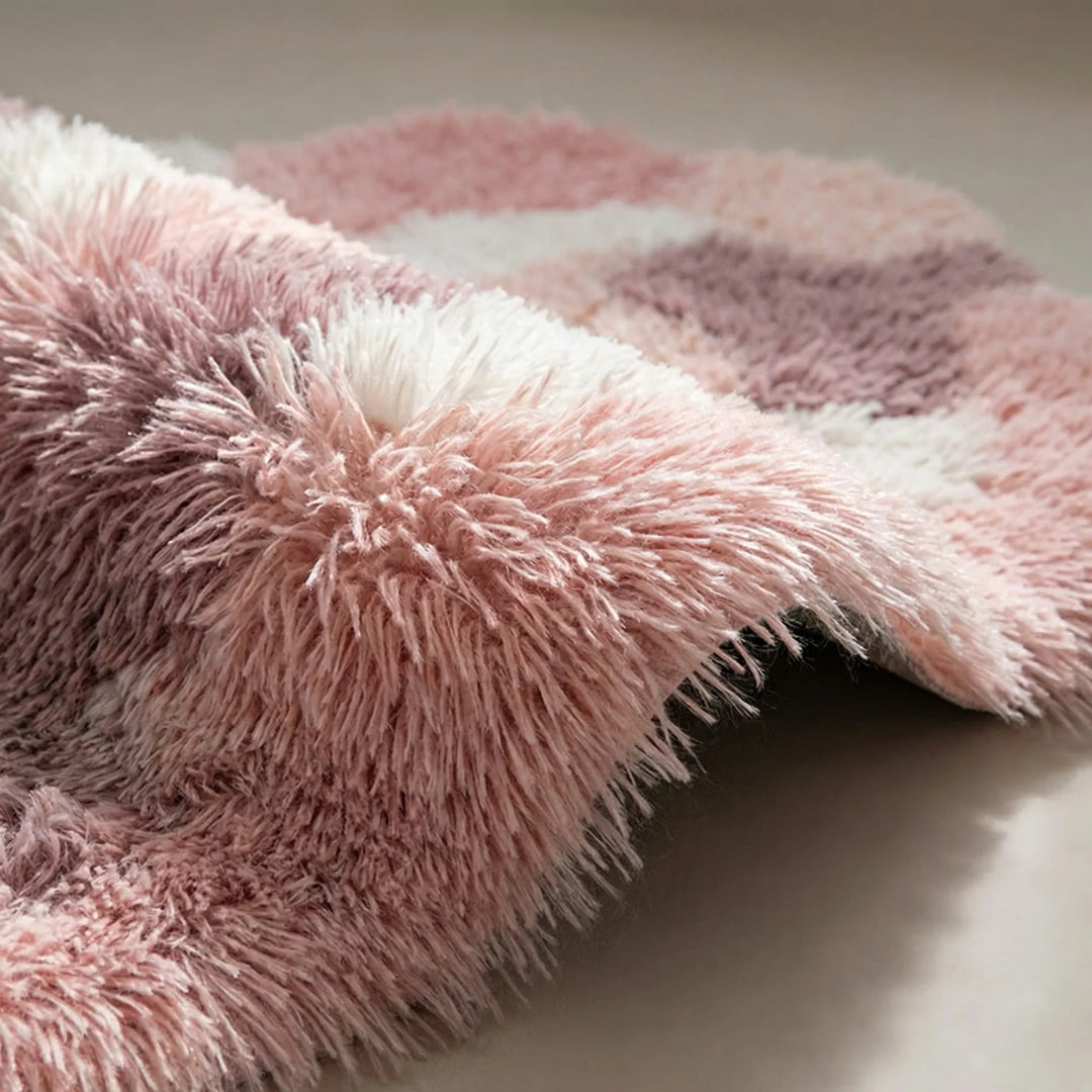 Statement sculpted area rug with elegant wave design, a soft pastel accent for modern home decor.