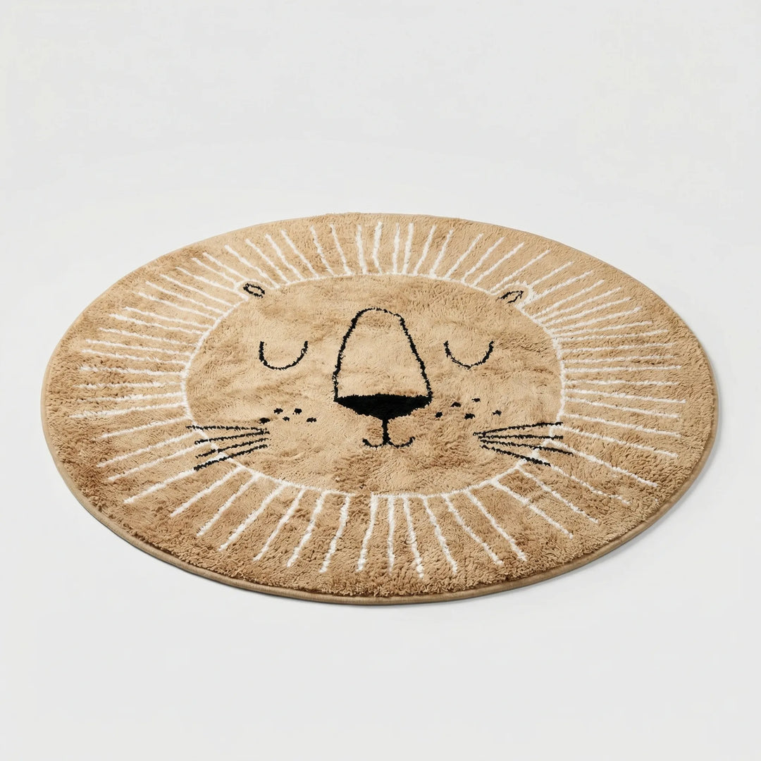 Boho round lion play rug for kids' room. Soft, washable nursery area rug with playful waves & Flowique design.