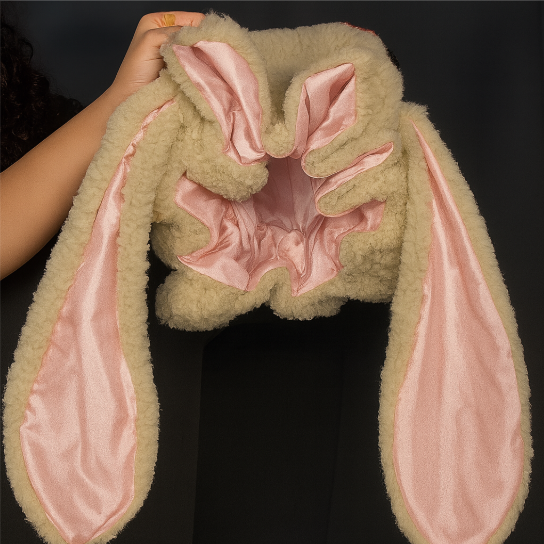 Warm women's bunny bonnet hat, featuring plush fabric & long ears, a stylish accessory for winter outfits.