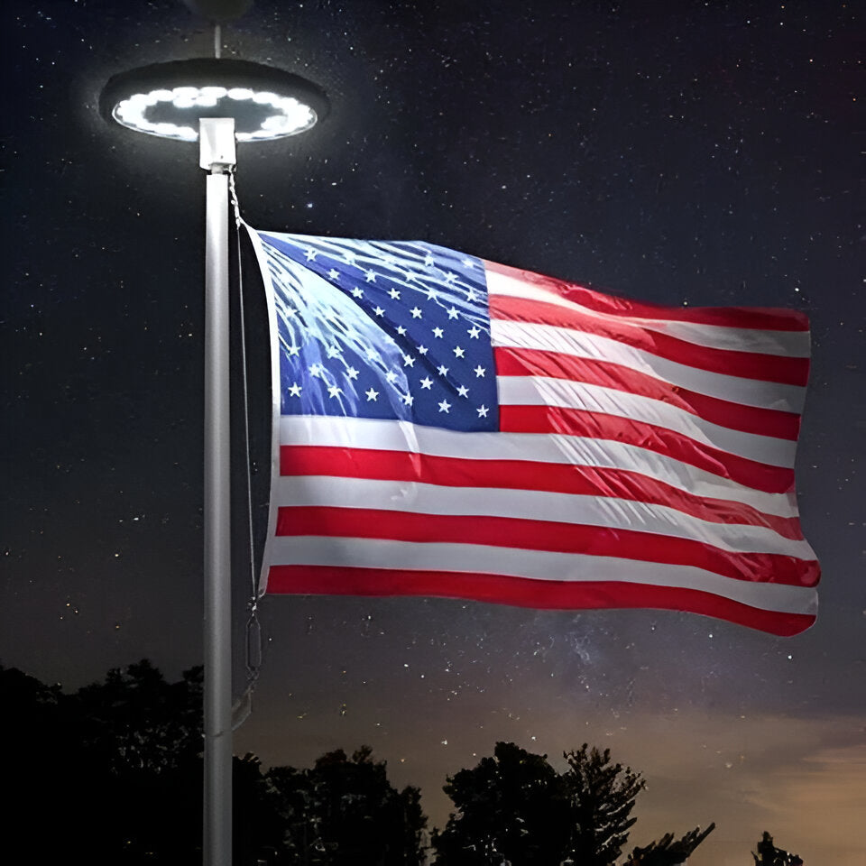 Solar LED flagpole light automatically illuminates flags from dusk to dawn. Bright outdoor flag display.