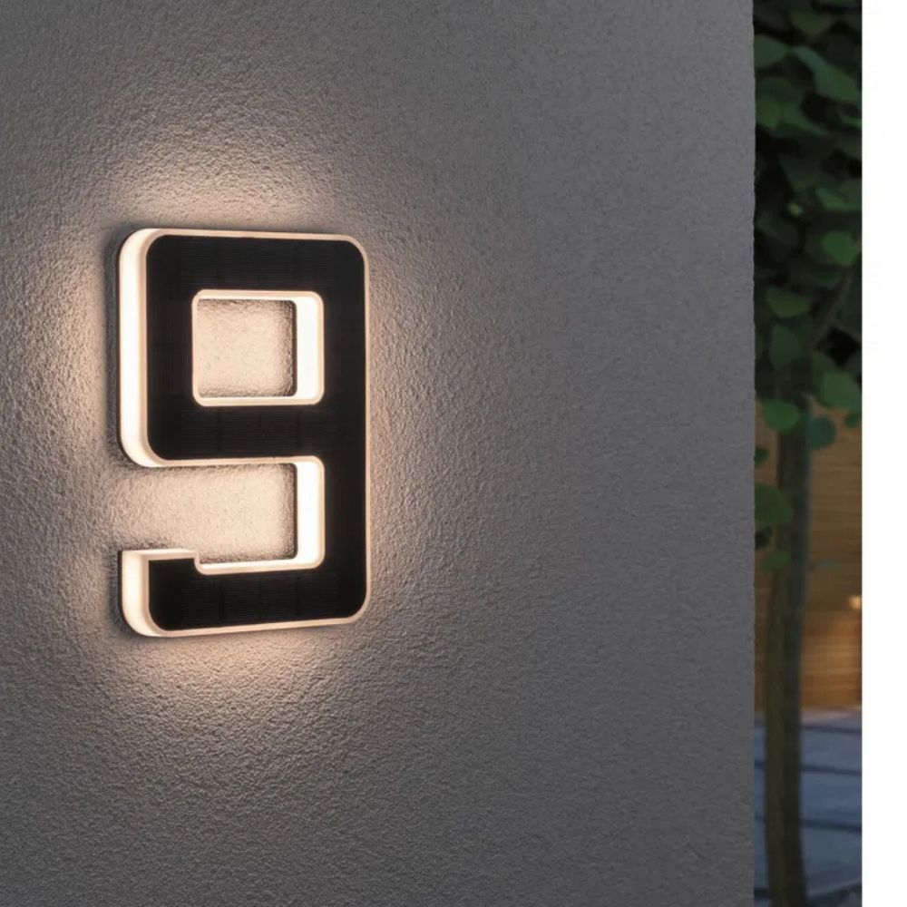 Detail of the solar panel on the illuminated house number for auto-charging.