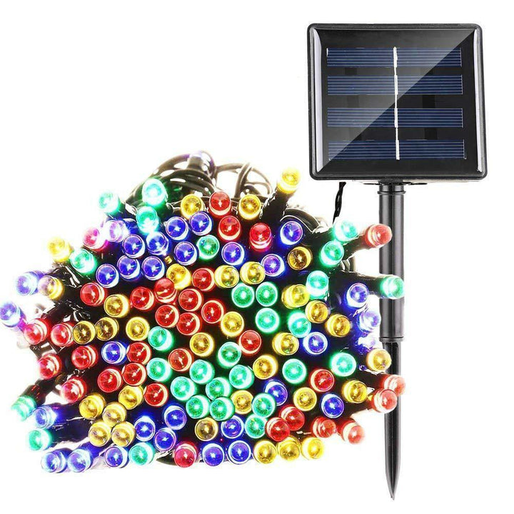 Eco-friendly solar LED fairy lights providing soft, decorative illumination for a backyard garden party.