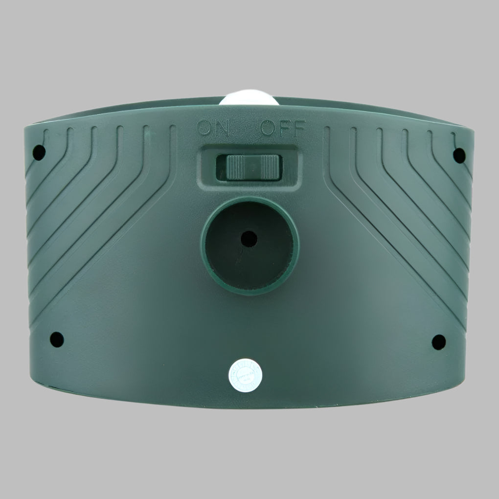 Wireless solar rabbit repeller installed in garden. Ultrasonic pest control device for yard defense, easy setup.