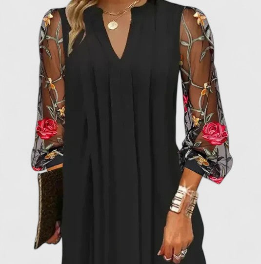 Elegant black long sleeve mini dress, a sophisticated v-neck party dress for women's evening fashion.