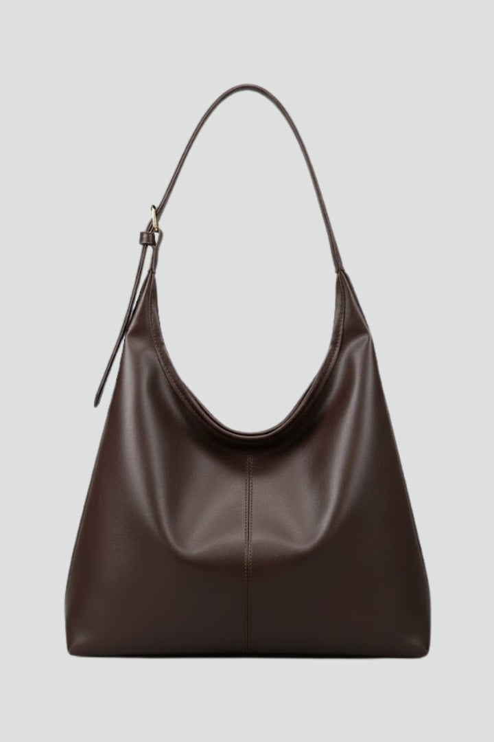 Spacious women's carryall handbag, versatile for everyday fashion. A stylish shoulder tote.
