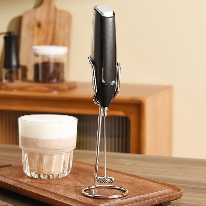 Modern handheld milk frother with stand, suitable for coffee, lattes, and cappuccinos