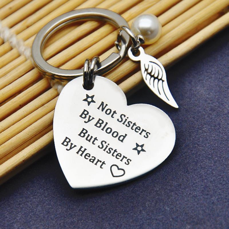 Personalized sisterhood keychain, polished stainless steel, a lasting inspirational gift for friends.
