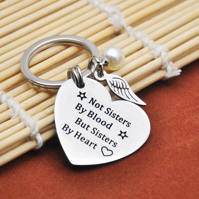 Women's sisterhood keychain, durable stainless steel construction, perfect friendship keepsake.