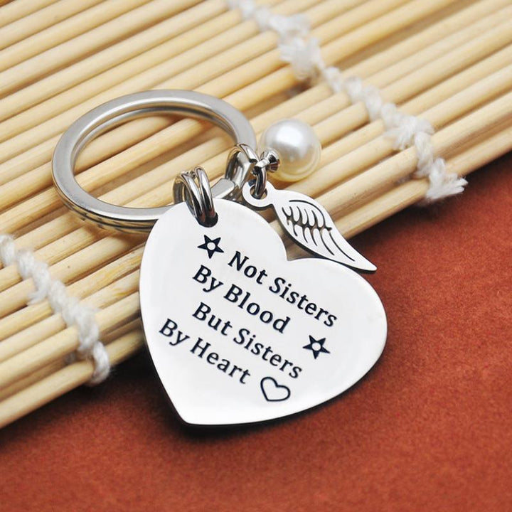 Women's sisterhood keychain, durable stainless steel construction, perfect friendship keepsake.