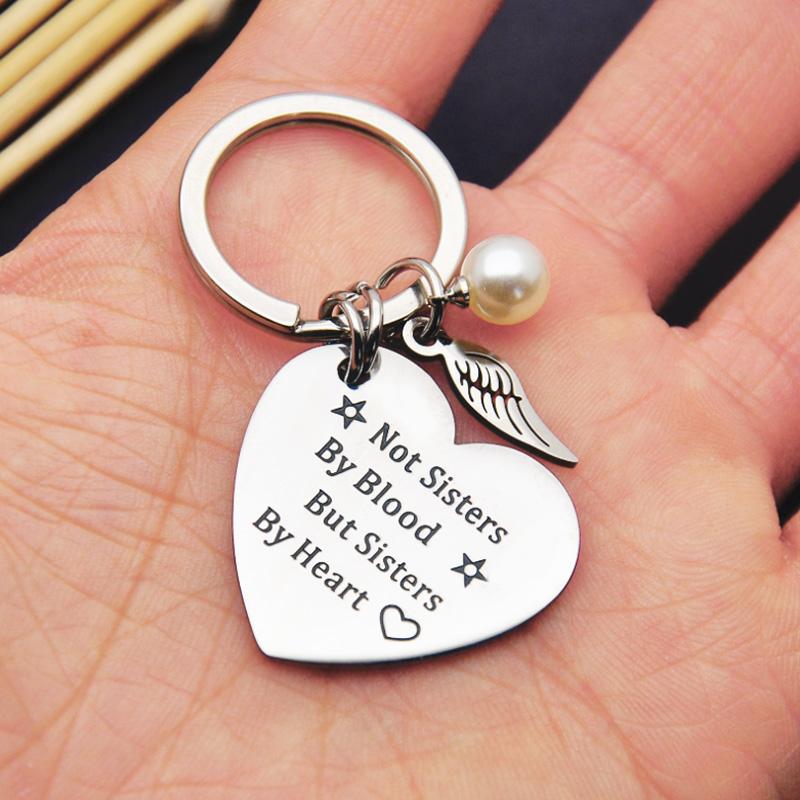 Silver-toned stainless steel sisterhood keychain gift, elegant and enduring accessory for women.