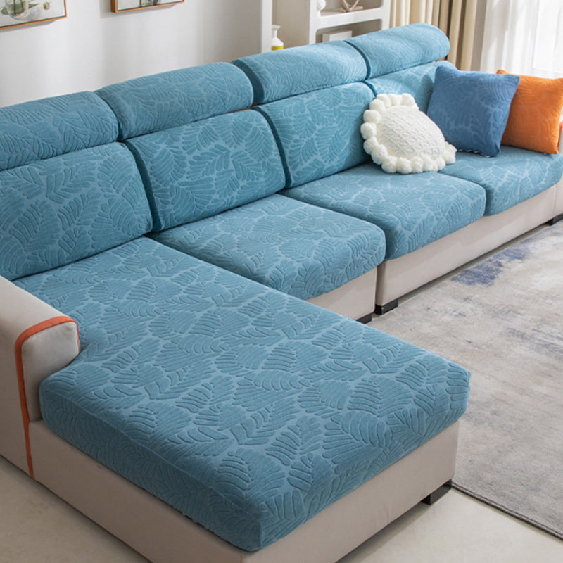 Elegant living room with a white sofa cover, providing a clean, fresh look and robust furniture protection.