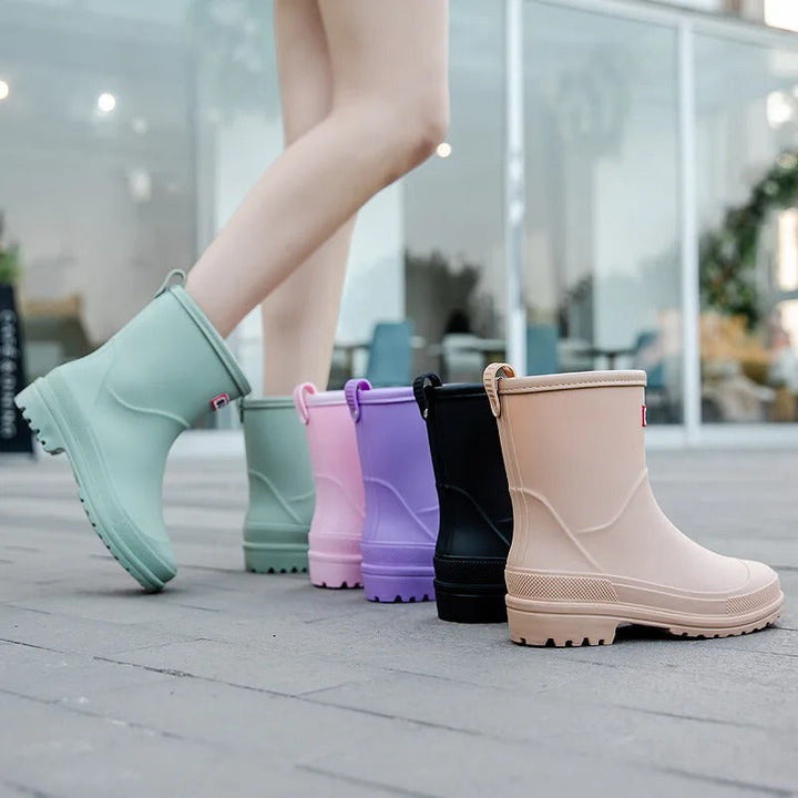 Stylish purple women's waterproof ankle boots, perfect rain footwear for a fashionable wet weather look.